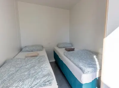 Łóżko lub łóżka w pokoju w obiekcie Forteca, słoneczne domki rekreacyjne