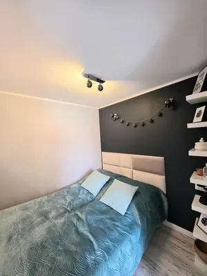 Łóżko lub łóżka w pokoju w obiekcie Apartament Z Widokiem Na Wieżę