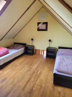 Łóżko lub łóżka w pokoju w obiekcie Apartamenty Na Poddaszu