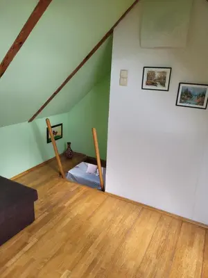 Łóżko lub łóżka w pokoju w obiekcie Apartamenty Na Poddaszu