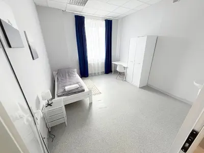 Łóżko lub łóżka w pokoju w obiekcie MobiRooms - Pokoje i Apartamenty