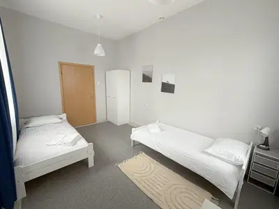 Łóżko lub łóżka w pokoju w obiekcie MobiRooms - Pokoje i Apartamenty