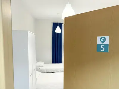 Łóżko lub łóżka w pokoju w obiekcie MobiRooms - Pokoje i Apartamenty