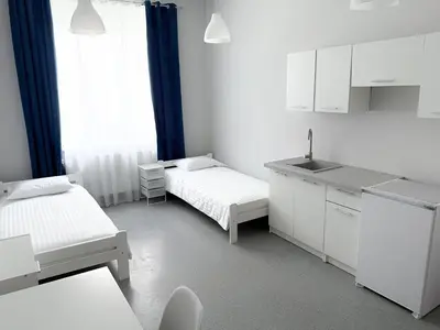 Łóżko lub łóżka w pokoju w obiekcie MobiRooms - Pokoje i Apartamenty