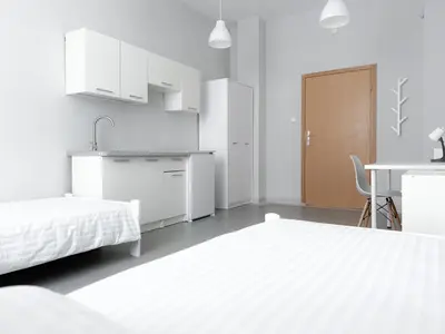 Łóżko lub łóżka w pokoju w obiekcie MobiRooms - Pokoje i Apartamenty
