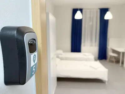 Łóżko lub łóżka w pokoju w obiekcie MobiRooms - Pokoje i Apartamenty