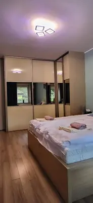 Łóżko lub łóżka w pokoju w obiekcie AMJ Apartament