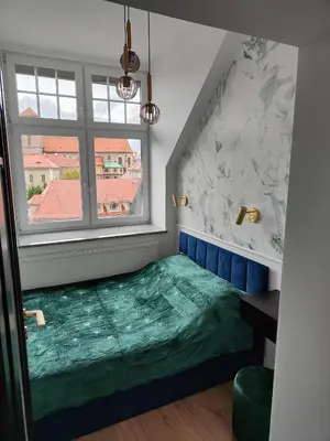 Łóżko lub łóżka w pokoju w obiekcie Apartament Jak w banku II