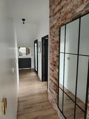 Łóżko lub łóżka w pokoju w obiekcie Apartament Jak w banku II