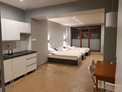 Łóżko lub łóżka w pokoju w obiekcie Apartamenty Bednarska 2a