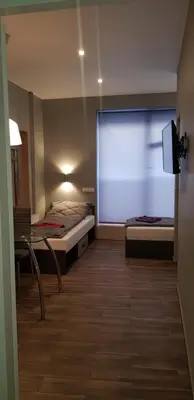 Łóżko lub łóżka w pokoju w obiekcie Apartamenty Bednarska 2a