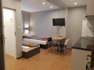 Łóżko lub łóżka w pokoju w obiekcie Apartamenty Bednarska 2a