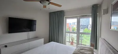 Łóżko lub łóżka w pokoju w obiekcie Apartament z widokiem na Sky Tower