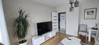 Telewizja i/lub zestaw kina domowego w obiekcie Apartament z widokiem na Sky Tower