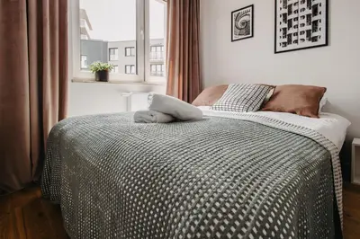 Łóżko lub łóżka w pokoju w obiekcie Białowieska 67 - Apartament z sypialnią, balkon w Porcie Popowice - Wrocław - Fair Rentals