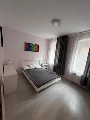 Łóżko lub łóżka w pokoju w obiekcie MaWi Apartament