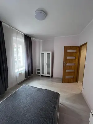 Łóżko lub łóżka w pokoju w obiekcie MaWi Apartament