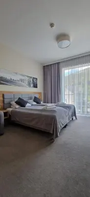 Łóżko lub łóżka w pokoju w obiekcie Apartament Czarna Góra Silver