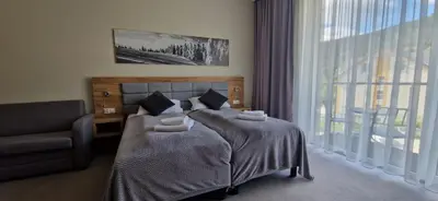 Łóżko lub łóżka w pokoju w obiekcie Apartament Czarna Góra Silver