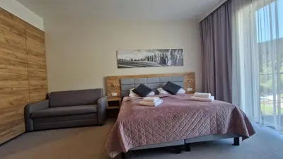 Łóżko lub łóżka w pokoju w obiekcie Apartament Czarna Góra Silver