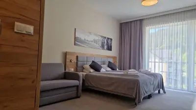 Łóżko lub łóżka w pokoju w obiekcie Apartament Czarna Góra Silver