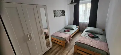 Łóżko lub łóżka w pokoju w obiekcie Apartament Biały Kamień