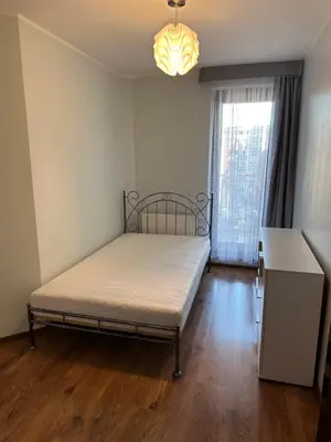Łóżko lub łóżka w pokoju w obiekcie Eleganckie mieszkanie w centrum Wrocławia