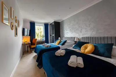 Łóżko lub łóżka w pokoju w obiekcie Westminster Apartments