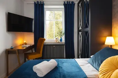 Łóżko lub łóżka w pokoju w obiekcie Westminster Apartments
