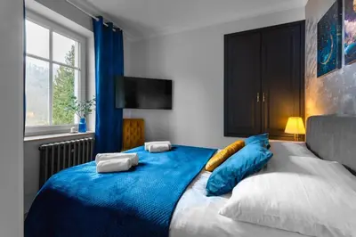 Łóżko lub łóżka w pokoju w obiekcie Westminster Apartments
