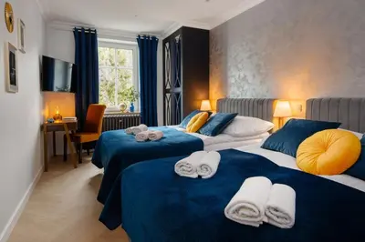 Łóżko lub łóżka w pokoju w obiekcie Westminster Apartments