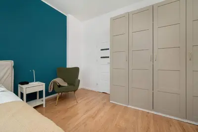 Łóżko lub łóżka w pokoju w obiekcie Spacious Apartment with WiFi & Smart TV Remote Working by Noclegi Renters