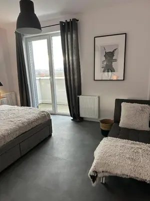 Łóżko lub łóżka w pokoju w obiekcie Apartment z tarasem