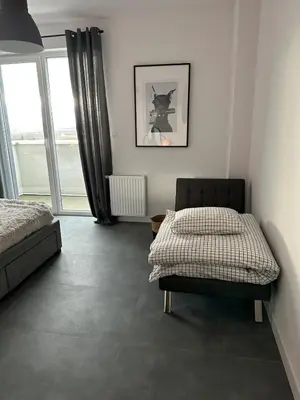 Łóżko lub łóżka w pokoju w obiekcie Apartment z tarasem