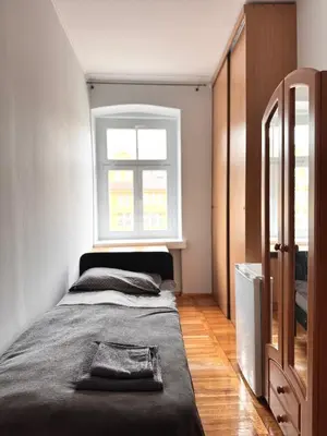 Łóżko lub łóżka w pokoju w obiekcie City Center - central apartment Kazimierza Wielkiego
