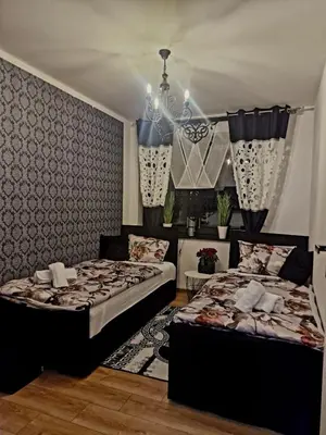 Łóżko lub łóżka w pokoju w obiekcie Apartament Marzenie
