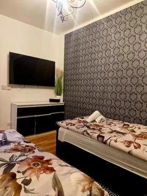 Łóżko lub łóżka w pokoju w obiekcie Apartament Marzenie