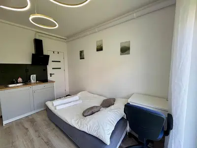 Łóżko lub łóżka w pokoju w obiekcie Studio Hop To Wrocław