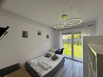 Łóżko lub łóżka w pokoju w obiekcie Studio Hop To Wrocław