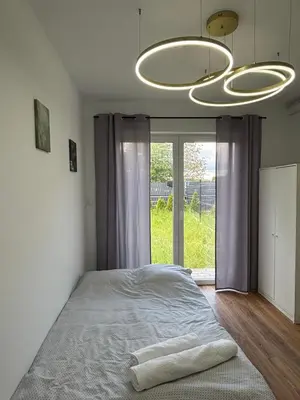 Łóżko lub łóżka w pokoju w obiekcie Studio Hop To Wrocław