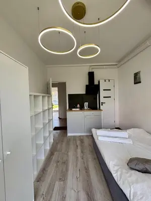 Łóżko lub łóżka w pokoju w obiekcie Studio Hop To Wrocław