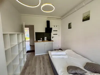 Łóżko lub łóżka w pokoju w obiekcie Studio Hop To Wrocław
