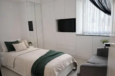 Łóżko lub łóżka w pokoju w obiekcie Zielone Stablowice Wrocław