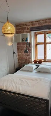 Łóżko lub łóżka w pokoju w obiekcie Na Rynku