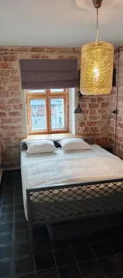 Łóżko lub łóżka w pokoju w obiekcie Na Rynku