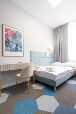 Łóżko lub łóżka w pokoju w obiekcie Moon ApartHotel