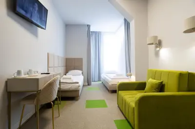 Łóżko lub łóżka w pokoju w obiekcie Moon ApartHotel
