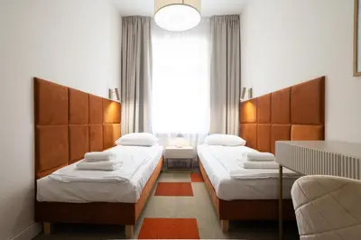 Łóżko lub łóżka w pokoju w obiekcie Moon ApartHotel