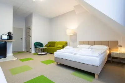 Łóżko lub łóżka w pokoju w obiekcie Moon ApartHotel