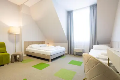 Łóżko lub łóżka w pokoju w obiekcie Moon ApartHotel